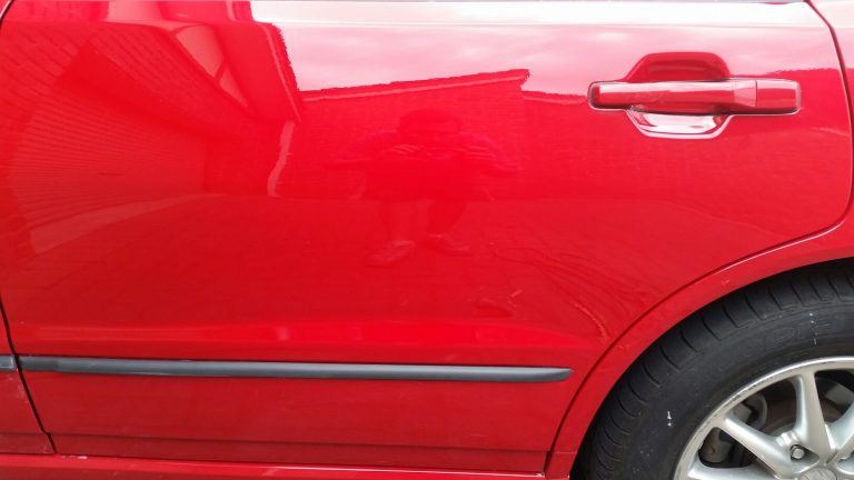 Repaired paint damage on rear door of Magna