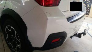 Pearl White bumper after the dent has been removed